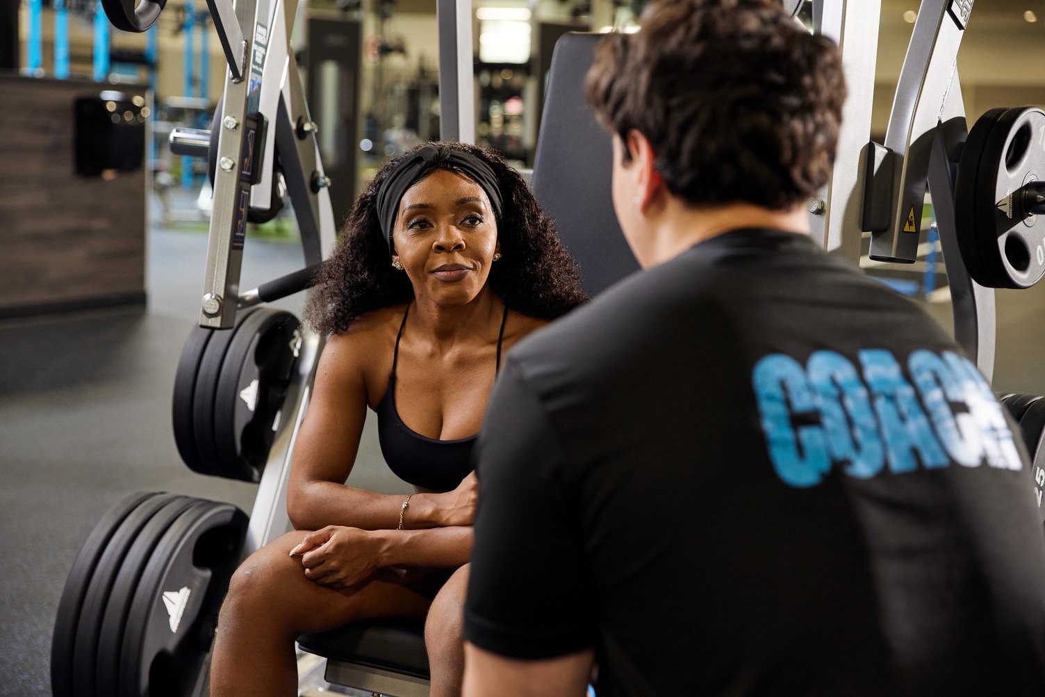 In-club: trainer reviewing results with a member