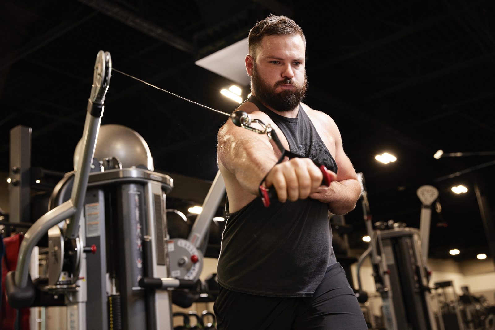 Athlete performing a cable fly in the gym