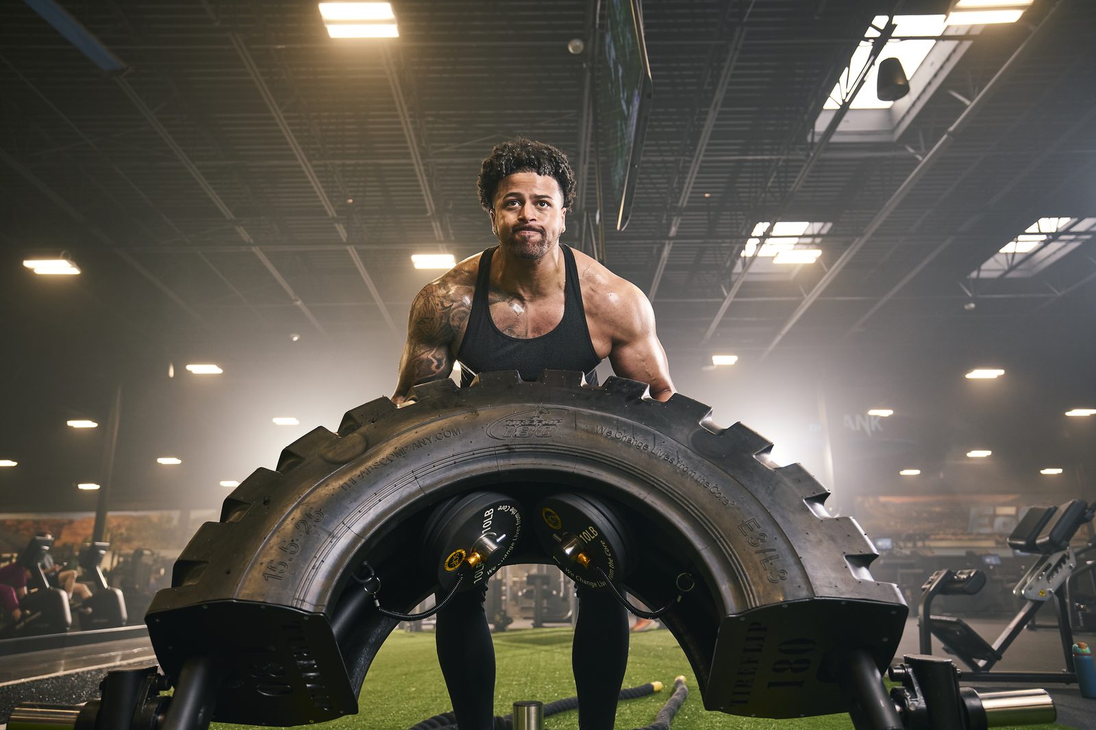 Athlete flipping a training tire in the gym